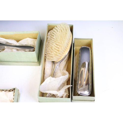 623 - Early 20th Century silver hallmarked dressing set to include comb, two hair brushes, two clothes bru... 