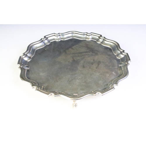 669 - 1920s silver hallmarked salver having stepped rims with scrolled feet. Hallmarked Birmingham 1926, S... 