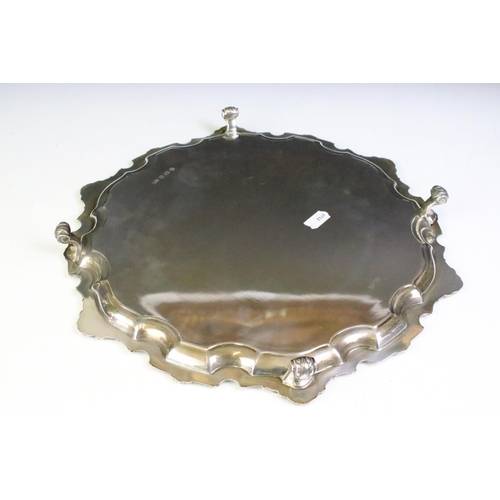 671 - 1960s Mappin & Webb silver hallmarked footed salver tray having a shell moulded rim raised on scroll... 