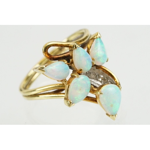 280 - 18ct gold and opal ring set with five tear drop shaped opal cabochons with diamond accent stones. Ma... 