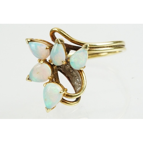 280 - 18ct gold and opal ring set with five tear drop shaped opal cabochons with diamond accent stones. Ma... 