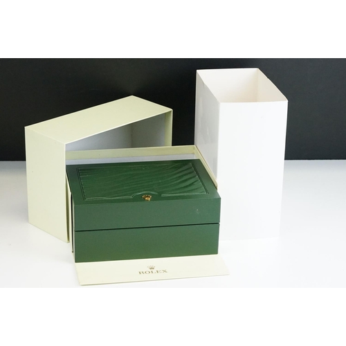 544 - Rolex - A collection of five green empty Rolex watch boxes each having wave design panel to top with... 