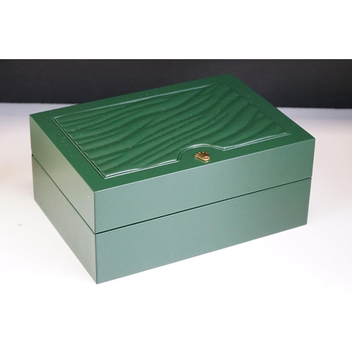 544 - Rolex - A collection of five green empty Rolex watch boxes each having wave design panel to top with... 