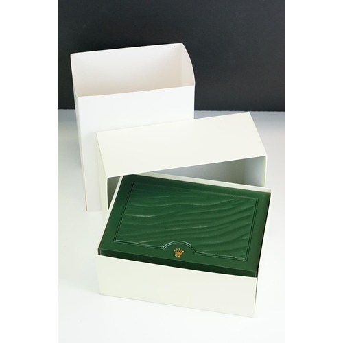 544 - Rolex - A collection of five green empty Rolex watch boxes each having wave design panel to top with... 