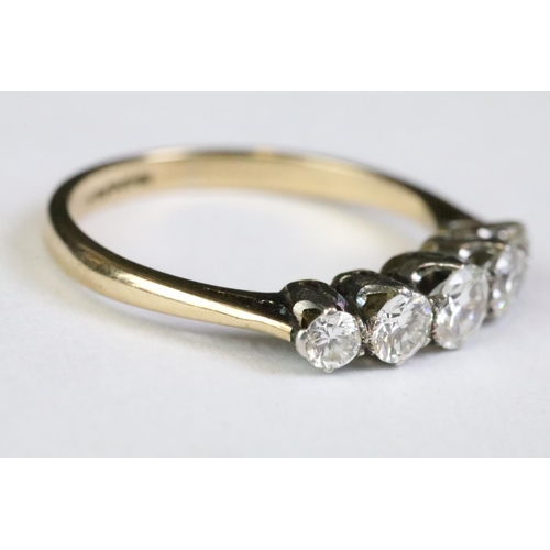 320A - 18ct gold and diamond five stone ring being set with five graduating round brilliant cut diamonds. B... 