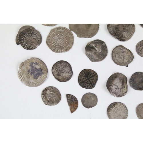 101A - A collection of British hammered silver coins to include Queen Elizabeth I examples, long cross penn... 