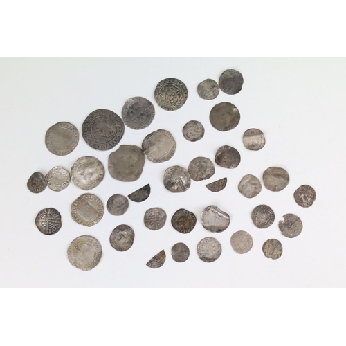 101A - A collection of British hammered silver coins to include Queen Elizabeth I examples, long cross penn... 