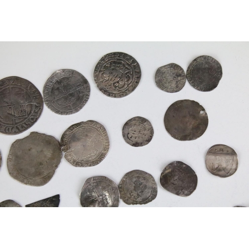 101A - A collection of British hammered silver coins to include Queen Elizabeth I examples, long cross penn... 