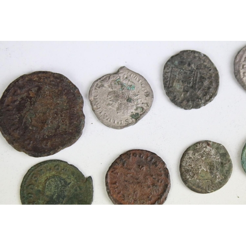 301 - A collection of early Roman coins to include Bronze and Silver examples