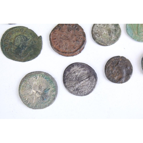 301 - A collection of early Roman coins to include Bronze and Silver examples