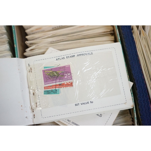 328 - Quantity of assorted used world stamps in Atlas stamp approvals stamp books. Most dating from the se... 