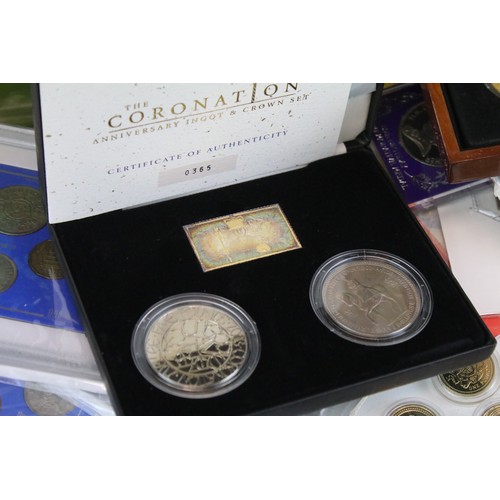 245 - A large collection of British Royal mint uncirculated coin sets to include £1, 50p and £2 examples t... 