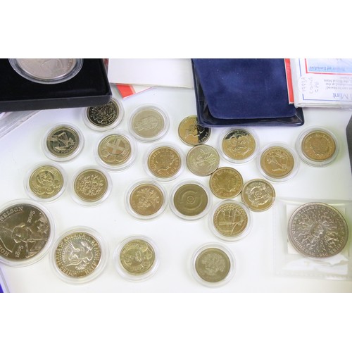 245 - A large collection of British Royal mint uncirculated coin sets to include £1, 50p and £2 examples t... 