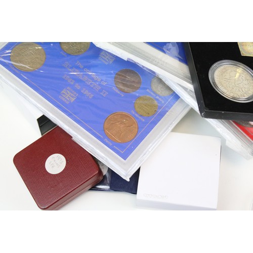 245 - A large collection of British Royal mint uncirculated coin sets to include £1, 50p and £2 examples t... 