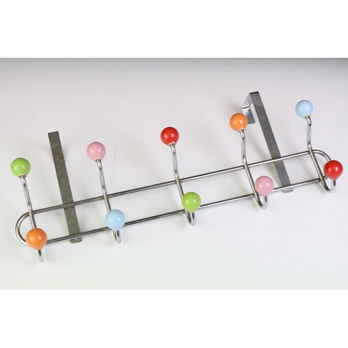 129 - Pair of mid Century vintage chrome door hanging coat hooks of sputnik style design each with coloure... 