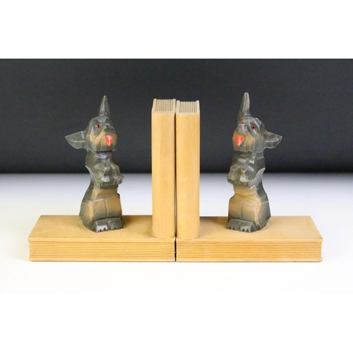 132 - Pair of Wooden Bookends in the form of Books and Carved Dogs, 13.5cm high