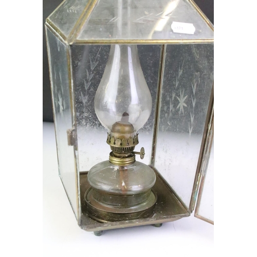 138 - Late 19th / early 20th century pair of brass framed glass oil lamp lanterns, the glass panels with e... 