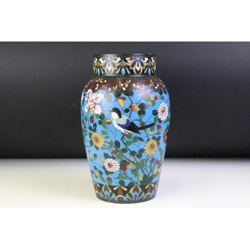 139 - Chinese cloisonne enamel vase with polychrome floral decoration on a blue ground, approx 25cm high