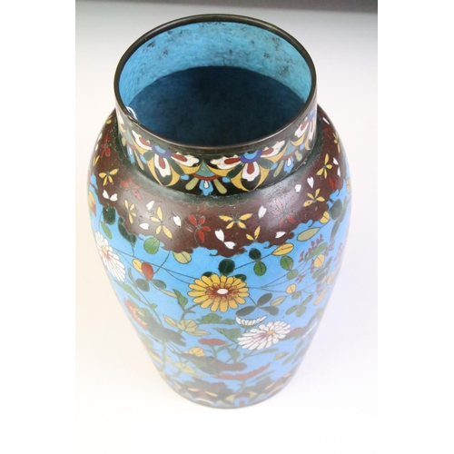 139 - Chinese cloisonne enamel vase with polychrome floral decoration on a blue ground, approx 25cm high