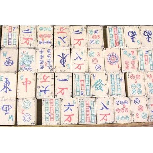 178 - Chinese mahjong set with wooden tiles and metal playing pieces, housed within trays in a wooden case... 