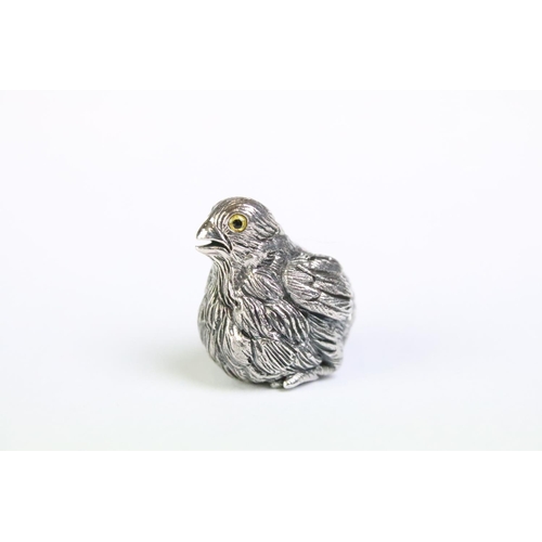 180 - Well cast silver chick figure with glass eyes