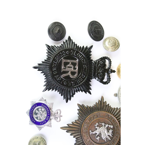 199 - A collection of British police force kings crown & queens crown helmet badges and buttons to include... 