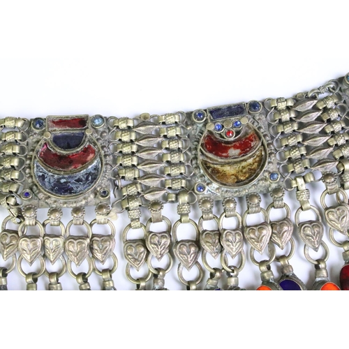 200 - A highly decorative Indian white metal collar necklace with decorative coloured stones.