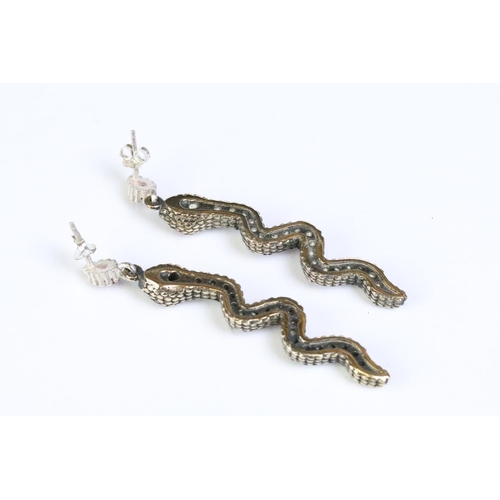 215 - Pair of silver, CZ and rubilite snake shaped earrings