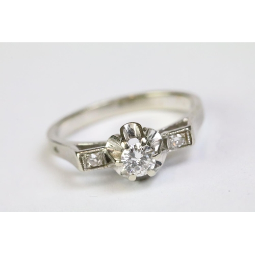 219 - White gold three stone diamond ring