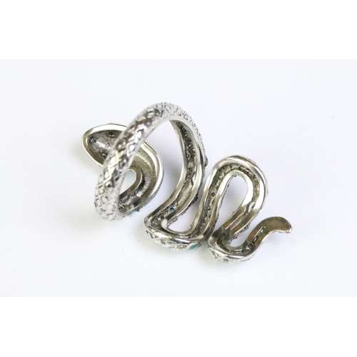 222 - A 925 sterling silver ladies snake ring, the body of the snake decorated with gemstones and green en... 