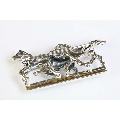 225 - Silver horse brooch on ruby platform