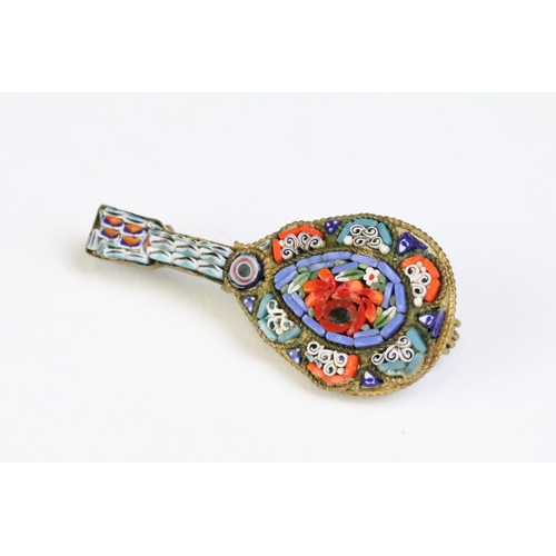 227 - A collection of four micro mosaic brooches to include two in the form of musical instruments