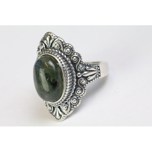 228 - A 925 Sterling silver with labradorite centre cabochon ladies ring with decorative surround, marked ... 