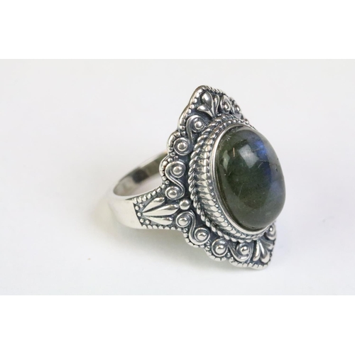 228 - A 925 Sterling silver with labradorite centre cabochon ladies ring with decorative surround, marked ... 