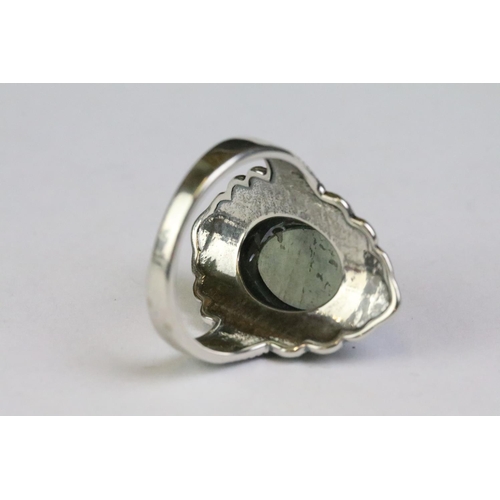 228 - A 925 Sterling silver with labradorite centre cabochon ladies ring with decorative surround, marked ... 