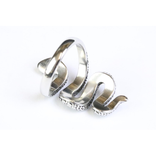 231 - A 925 sterling silver ladies snake ring, detailed scales to the snake and set with black stones to t... 