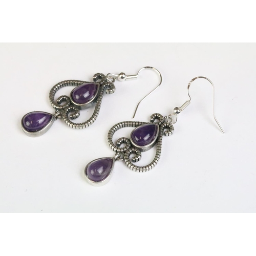 232 - A pair of 925 sterling silver ladies drop earrings, art nouveau in style and each set with two ameth... 