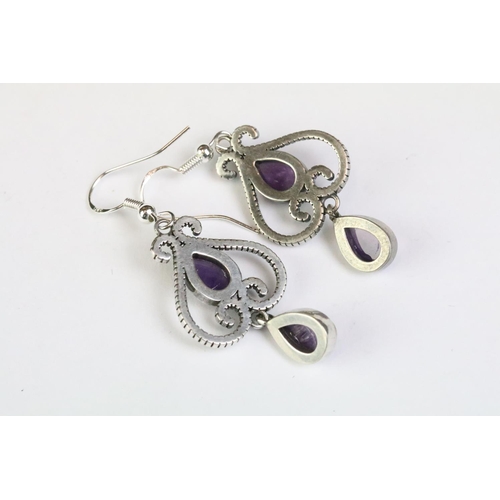 232 - A pair of 925 sterling silver ladies drop earrings, art nouveau in style and each set with two ameth... 