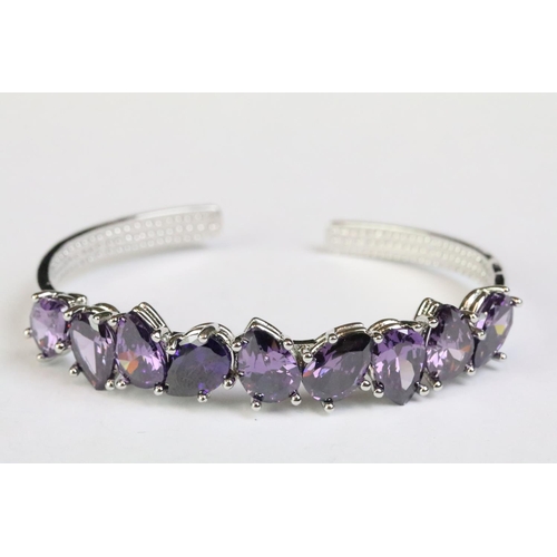 240 - A 925 sterling silver and amethyst open bangle bracelet, set with nine teardrop amethyst, marked 925... 