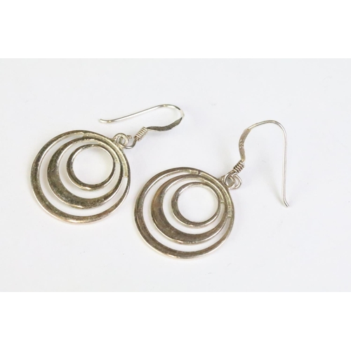 241 - A pair of sterling silver modernist drop earrings.