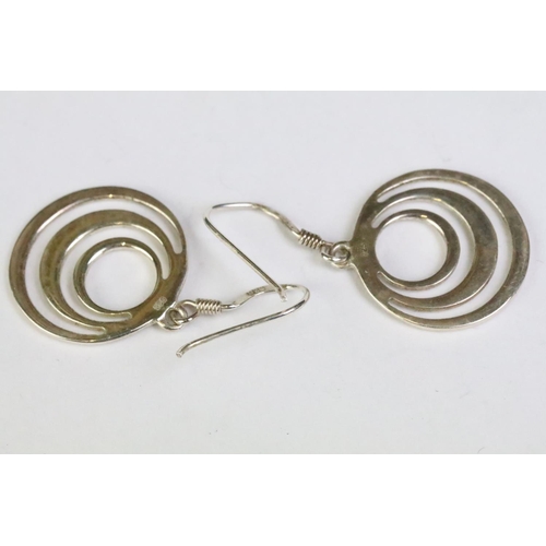 241 - A pair of sterling silver modernist drop earrings.