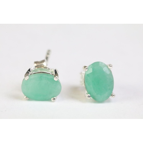 242 - Pair of emerald stud earrings on silver posts