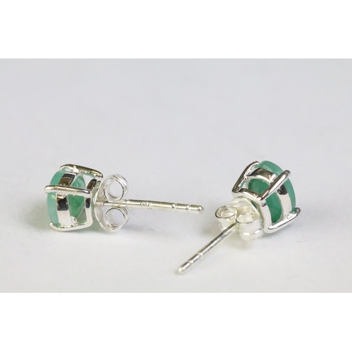 242 - Pair of emerald stud earrings on silver posts