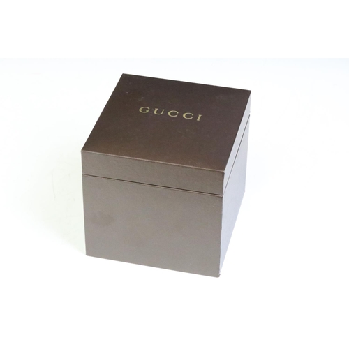 271 - Ladies Gucci diamond bezel wristwatch on black leather strap, complete with display box.