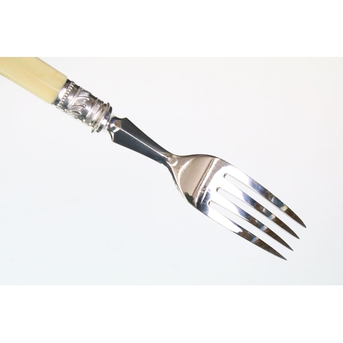 275 - A canteen of silver plated cutlery on faux ivory handles, complete with key.