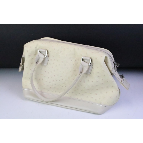 278 - A collection of Longchamp handbags, a cream ostrich skin handbag together with a black bag with bee ... 