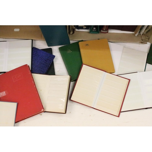 327 - Two albums of empty stamp albums / folders of varied size, to include faux leather examples