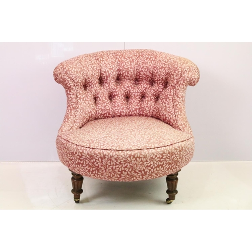 520 - Edwardian low tub armchair, with button back, on turned fluted tapering legs and casters, 66cm high ... 