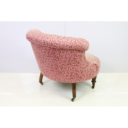 520 - Edwardian low tub armchair, with button back, on turned fluted tapering legs and casters, 66cm high ... 