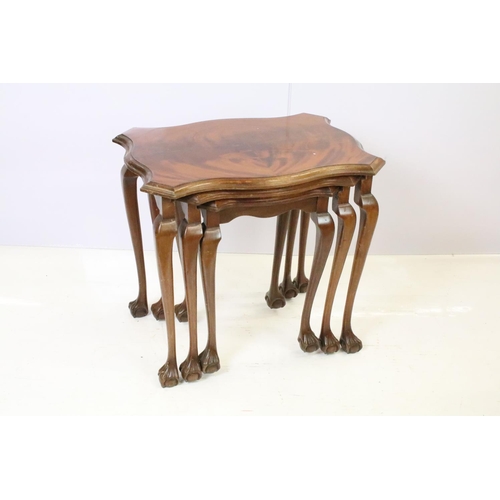 526 - Nest of three mahogany tables on ball and claw feet, the largest - 51cm high x 55cm wide x 41cm deep